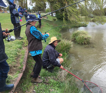 children catching trout at TroutFest